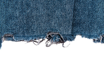 Piece of torn denim on a white background. Denim texture