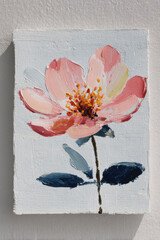 Bright pink flower painting on white canvas showcasing delicate petals and detailed textures, ideal for home decor or art lovers
