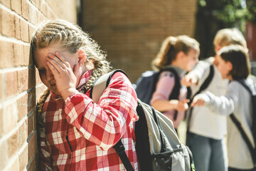 sad girl Bullying in Schoolyard with other student have some intimidation attitude