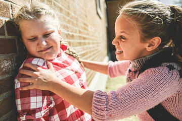 sad moment Elementary Age Bullying in Schoolyard