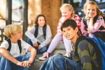 Group Of Young Children Hanging Out In Playground