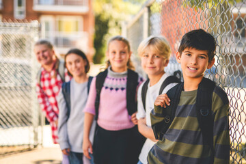Group Of Young Children Hanging Out In Playground