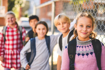Group Of Young Children Hanging Out In Playground