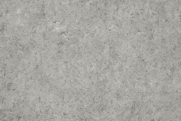 Subtle textured concrete surface background with speckled gray tones