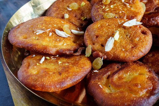 Taler Malpua | Traditional Bengali Sweet Pancakes Made with Palm Fruit and Jaggery, Fried and Soaked in Sugar Syrup | Authentic Bengali Dessert for Festivals and Special Occasions
