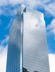 Modern glass building. Reflective glass architecture. Architecture in business area. Building architecture. Business building. Glass building. Business city. City architecture