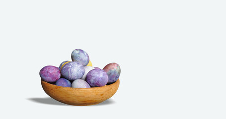 Painted Easter eggs in a wooden container. Cosmic theme. Pastel colors, blue dominance, minimalist egg decoration. Modern, futuristic, sustainable Easter