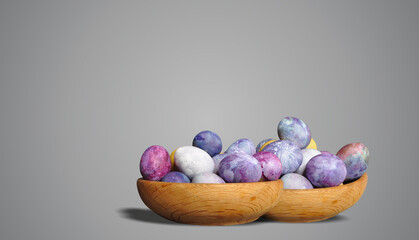 Painted Easter eggs in a wooden container. Two bowls with eggs. Cosmic theme. Pastel colors, blue dominance, minimalist egg decoration. Modern, futuristic, sustainable Easter