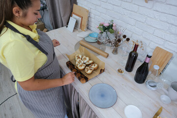 woman baking pears with ricotta and walnuts