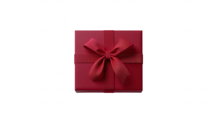 A beautifully wrapped red gift box with a satin ribbon bow. placed on a smooth gray surface. conveying a sense of anticipation and joy. ideal for holiday celebrations or special occasions