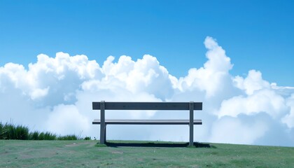Empty bench atop a hill, clouds fill the sky