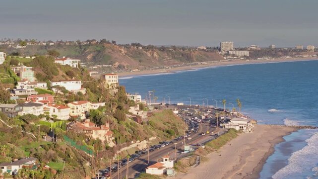 Scenic view of the pacific palisades coastline with houses on the hillside