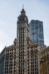 Iconic Chicago architecture featuring a historic clock tower and modern high-rise.