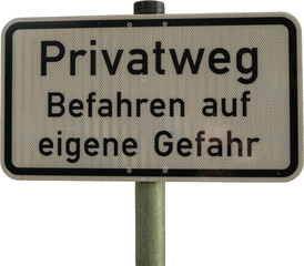 Obraz premium Private road sign warns drivers about accessing it at their own risk in a rural area