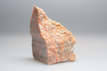 Granite stone close up on gray background