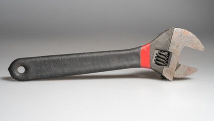 Adjustable wrench close up on gray background