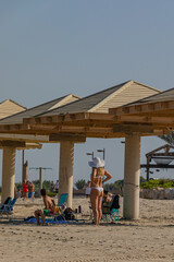 Woman in a white swimsuit on the beach