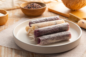 Khao Lam,glutinous rice roasted in bamboo.Baked Sticky Rice with coconut milk ,black bean and sugar in bamboo joints.Thai dessert.