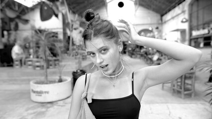 An Artistic and Stylish Portrait of a Young Woman Captured in a Vibrant Urban Setting