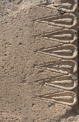 stone wall with pattern in ancient temple, Geghard, Armenia