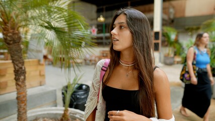 Exploring the vibe of Urban Chic A Stylish Young Woman Embracing a Trendy Environment