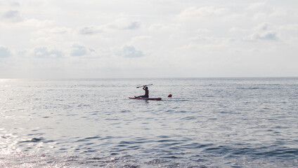Shot of the boy on the puddle board. Fun