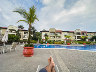 Relaxing by the pool at condominium