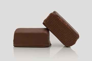 Cottage cheese bar in chocolate glaze. On a gray background. Sweet dessert.