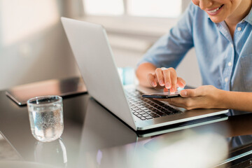 Working on laptop and smartphone