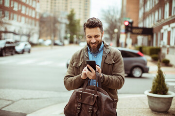 Man using smartphone outdoors