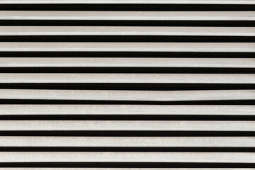 Obraz premium White horizontal blinds abstract background. Modern interior window shutter design. Lines and stripes minimal pattern. Contemporary home decor element. Architecture texture and detail.