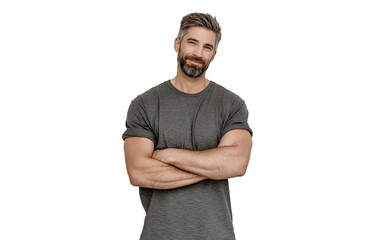 A man with a grey beard and short brown hair, wearing a grey tshirt, stands with his arms crossed and tilts his head slightly, isolated on transparent background