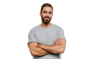 A handsome man with a beard and short brown hair, wearing a grey tshirt, stands with his arms crossed and smiles confidently, isolated on transparent background