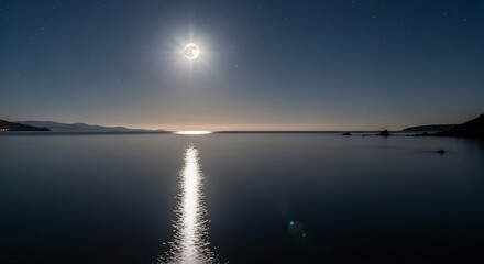 Fototapeta premium Moonlit ocean reflecting moon and stars with distant hills