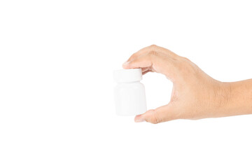 Hand holding a blank white plastic pill bottle for medicine or supplements, isolated on white background with clipping path.