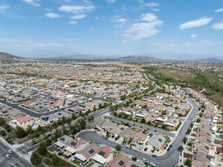 Fototapeta premium Aerial view of a sprawling neighborhood of family homes in Menifee city in Riverside County, California, United States