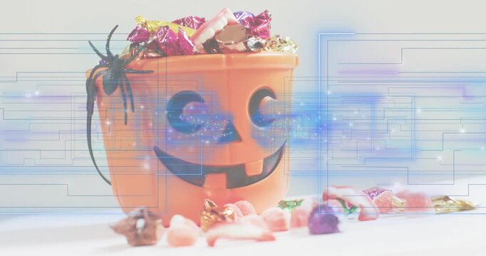 Faint circuit grid emerging and scanning jack-o-lantern candy bucket showing grin in glitch loop
