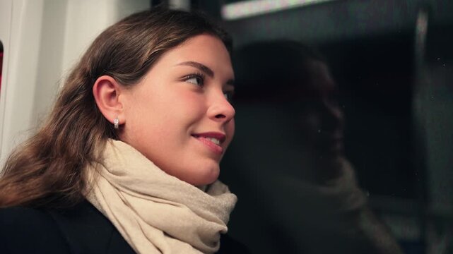 A young woman engages in deep contemplation while riding on public transport, embodying a moment of introspection during a busy urban commute, reflecting on her thoughts and surroundings.