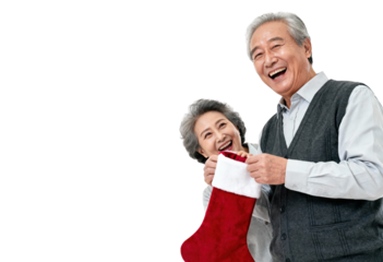 Happy Asian Senior Couple with Christmas Stocking Isolated