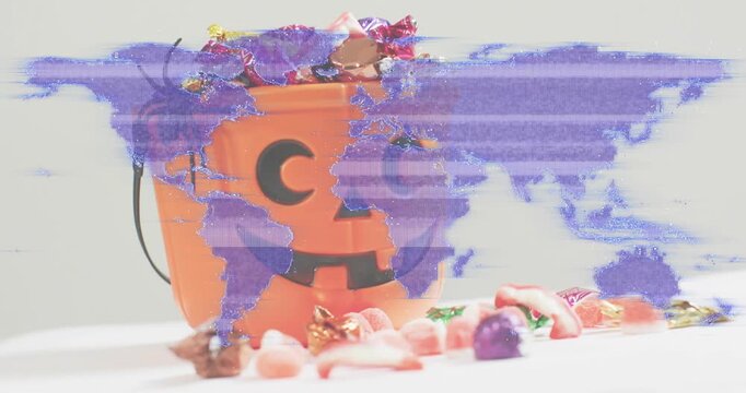 Heavy purple glitch effect shifting, receding revealing pumpkin bucket with spider, sweets spilling