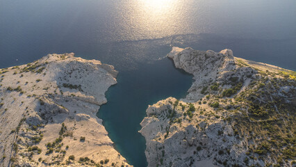 Aerial view of a dramatic canyon with turquoise water taken in Croatia, bay Zavratnica