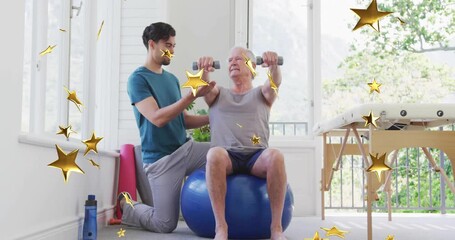 Therapist guiding senior client gripping dumbbells on ball while doing shoulder raises for therapy - Powered by Adobe