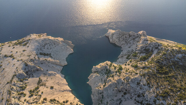 Aerial view of a dramatic canyon with turquoise water taken in Croatia, bay Zavratnica