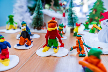 Plasticine skier on skis. Children's craft for New Year.