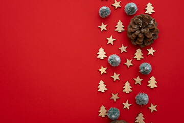 Red Christmas background decorated with wood with trees and stars