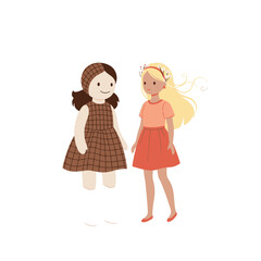 Two little girls standing side by side in colorful dresses and boots.