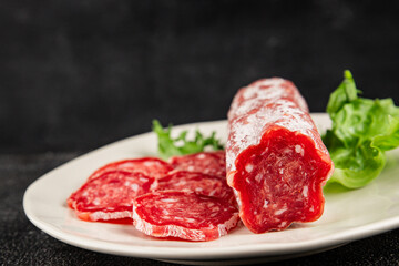 Dry sausage slice pork less fat jamon cured meat natural product tasty snack fresh delicious gourmet food background on the table rustic top view copy space