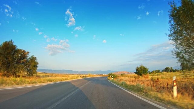Rural nature, joyride across beautiful golden valley, POV car drive