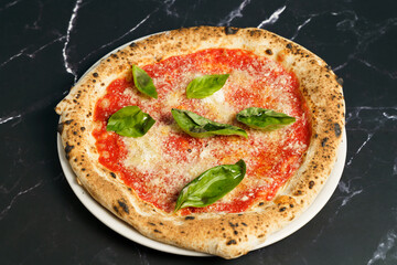 Traditional margherita pizza with fresh basil