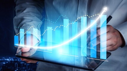 A business professional examines financial data on a digital tablet, surrounded by futuristic graphs and statistics, showcasing growth and innovation at night. Copula